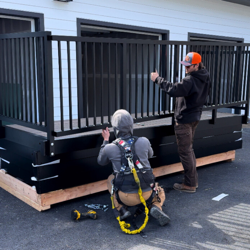 Multiple Aluminum Bolt-On Balconies attached to a multifamily apartment building in a coastal area