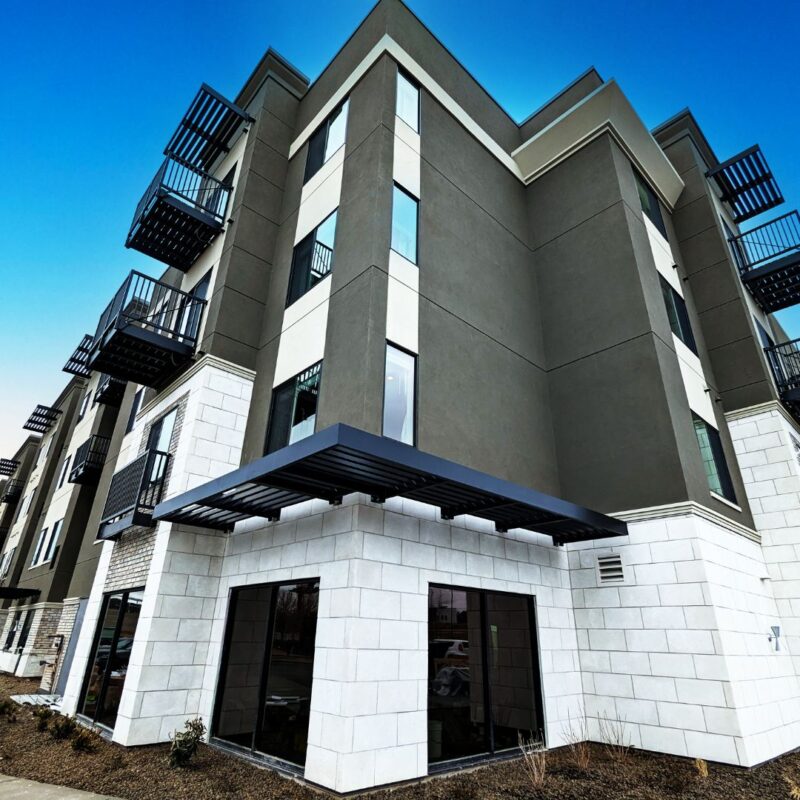 Multiple Aluminum Bolt-On Balconies attached to a multifamily apartment building in a coastal area